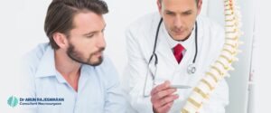 A doctor explaining Spinal Disc Replacement benefits